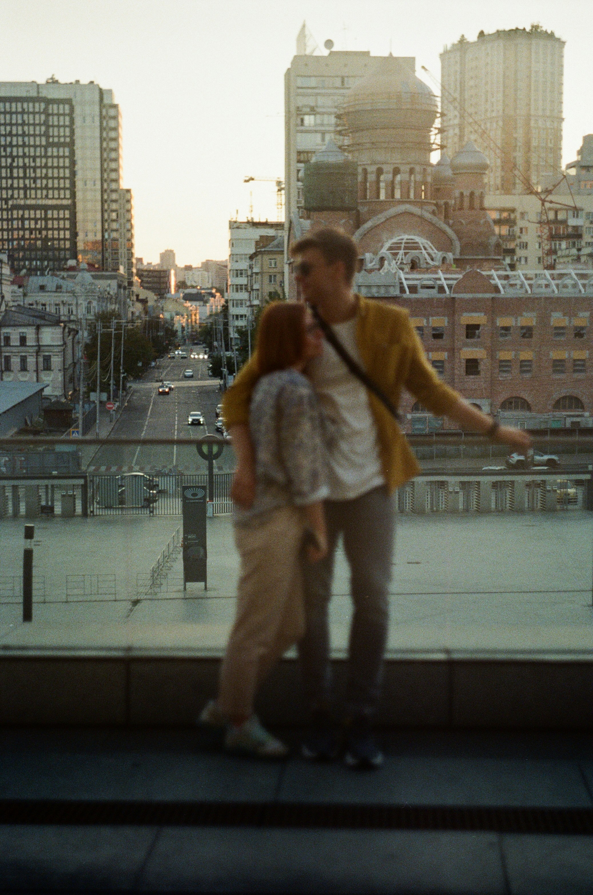Picture of Maggie and Brian hugging, overlooking a city
